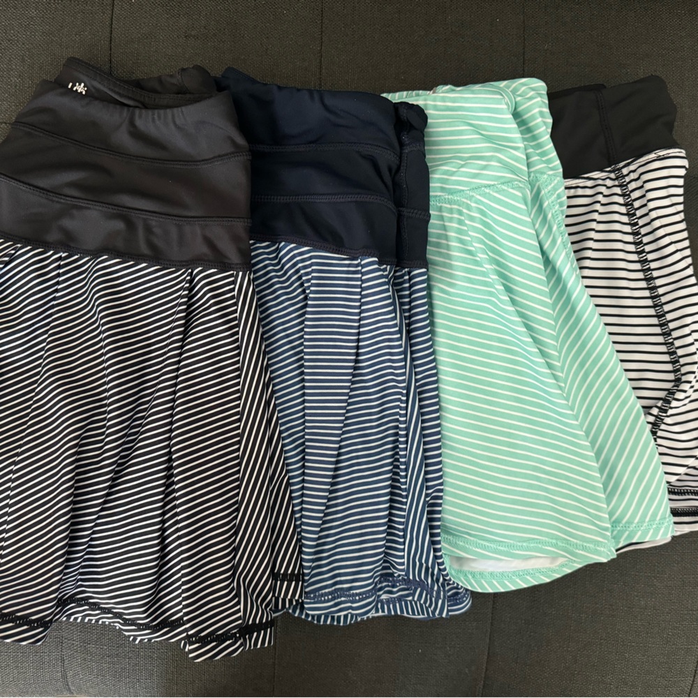 Lot of 4 striped athletic kyodan skirts with attached shorts